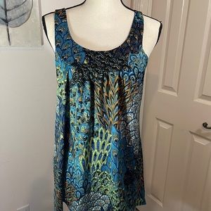 Peacock print sleeveless blouse vibrant colors
